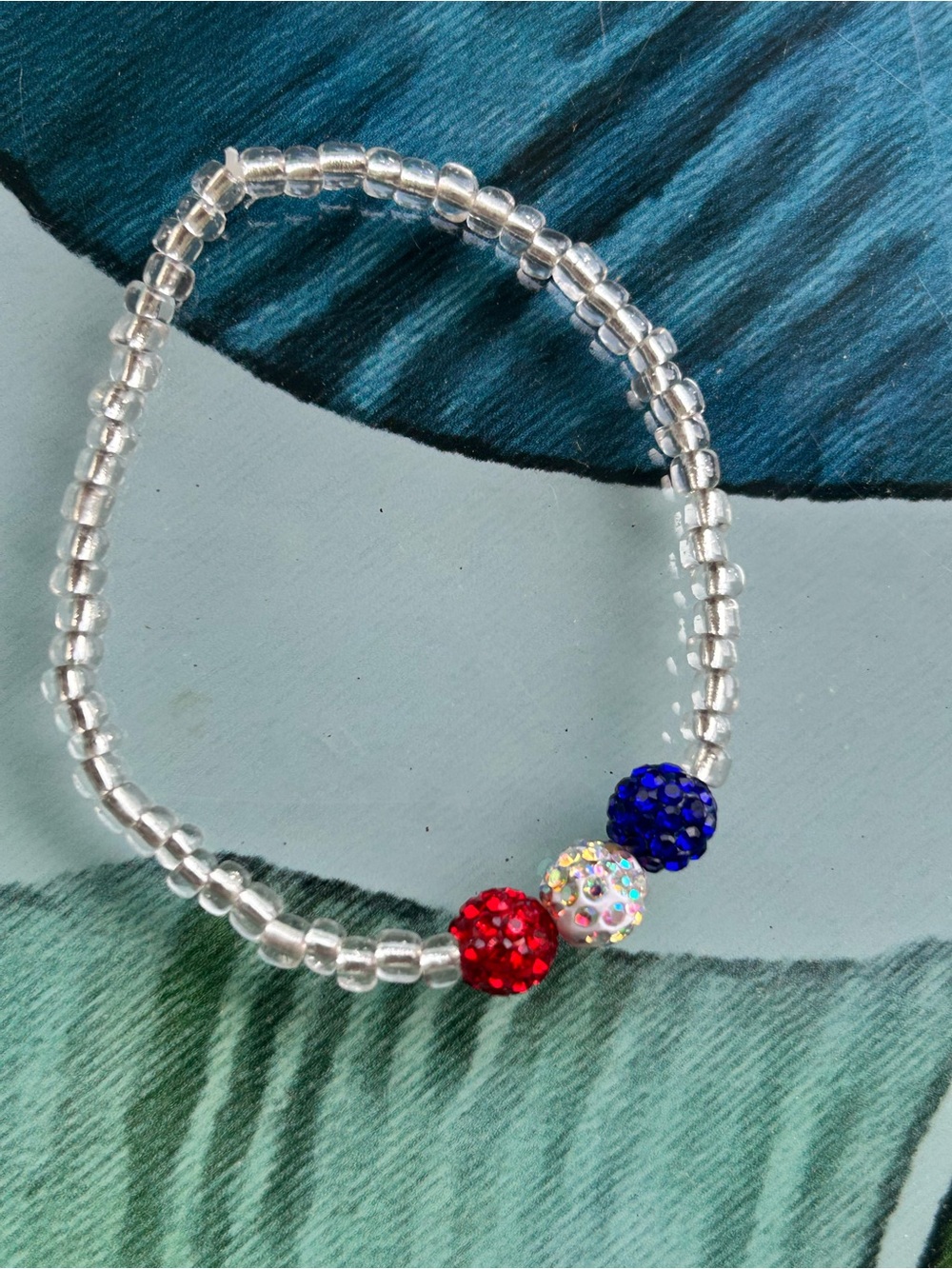 Beaded Stretch Bracelet with Red, Blue and Iridescent Accent Beads